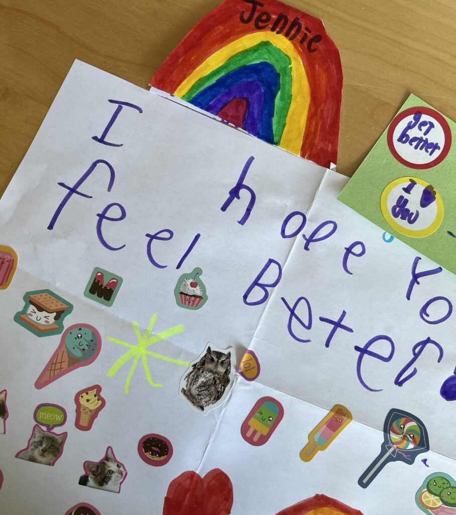 Hand drawn get well cards with stickers and rainbows from my niece and nephew.